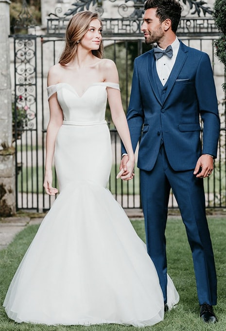 groom smiling at bride wearing allure bridal 9719 gown