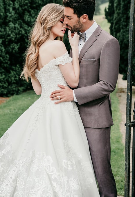 bride wearing allure couture c564 with husband