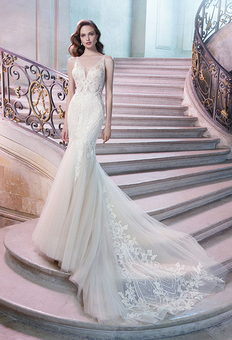 bride wearing enzoani philomina wedding dress on staircase