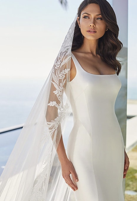bride wearing pronovias june wedding gown and veil