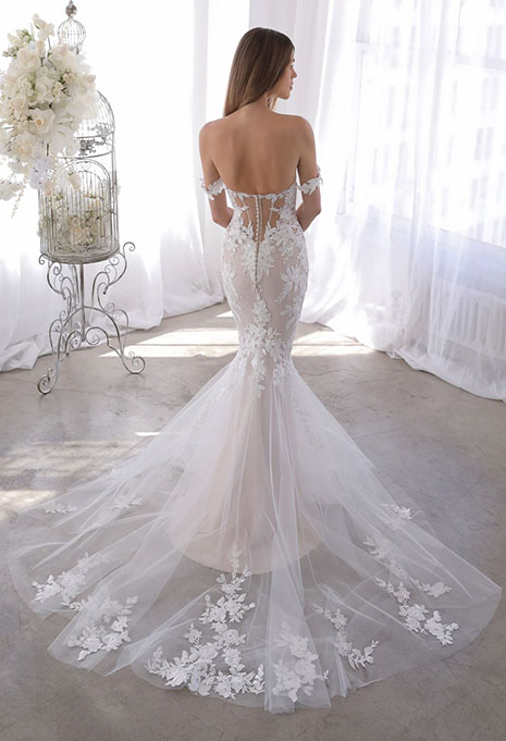 bride showing back of olenka gown