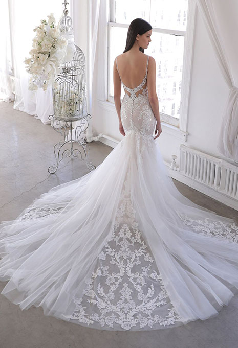 bride showing back of olexa wedding gown