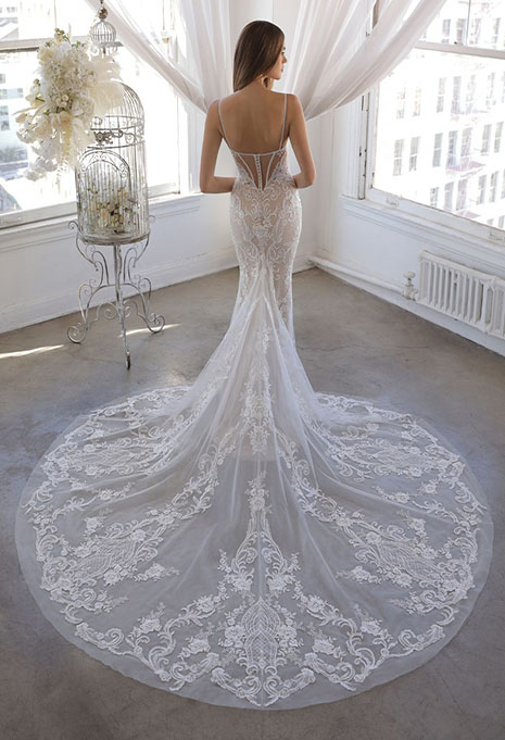 bride modeling back of olivine gown