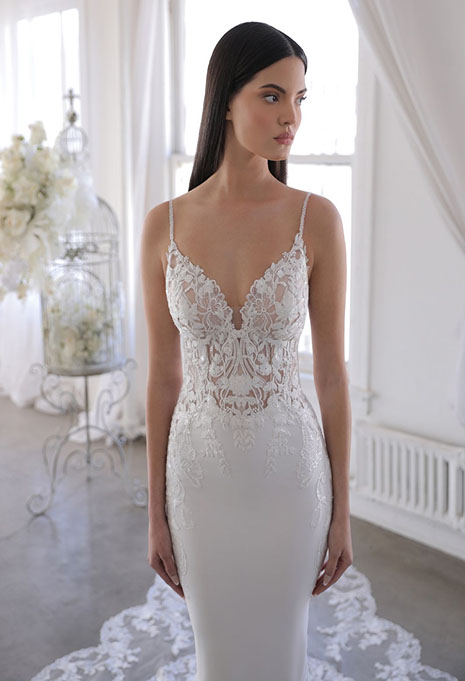 bride modeling front view of omari wedding gown