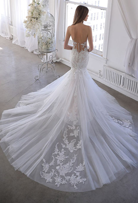 bride moedling back of blue by enzoani orchid gown