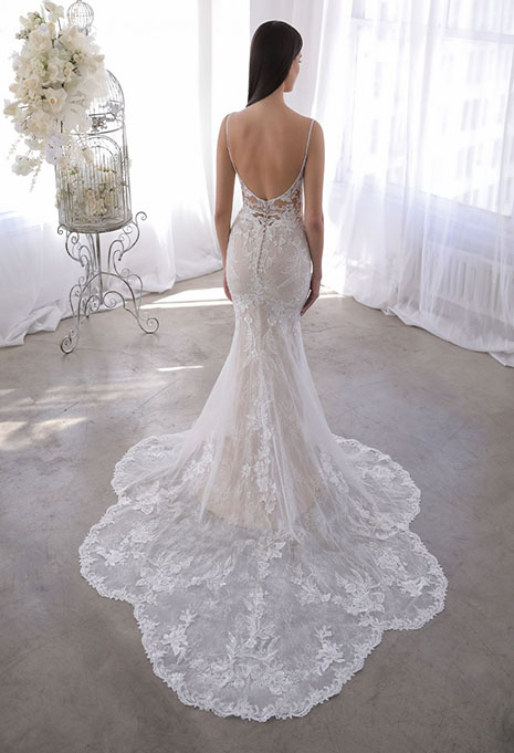 bride modeling back of blue by enzoani orna dress