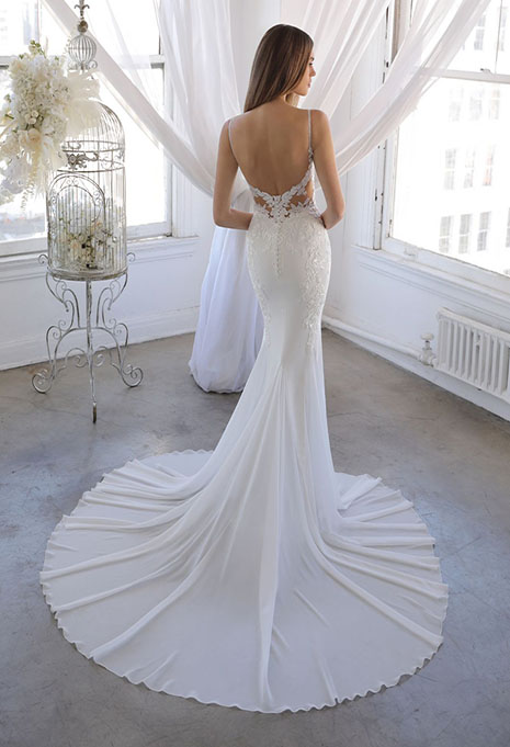 bride modeling back of ornina style wedding gown