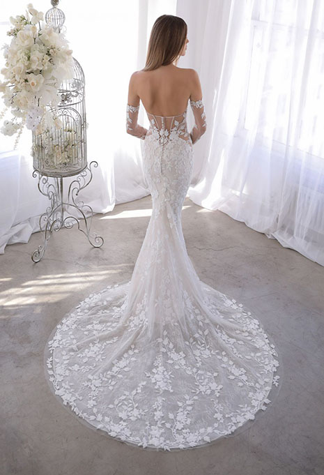 bride modeling back of blue by enzoani orrie gown