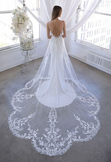blue-ozalea-dress-image-2 bride modeling back of ozalea dress with lace train