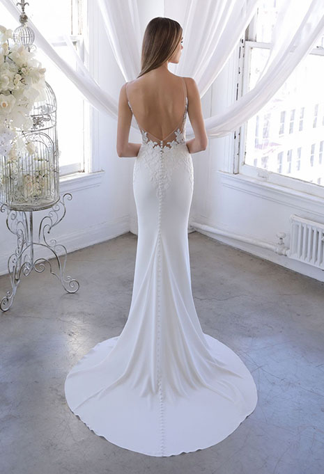 bride modeling back of ozalea dress without train