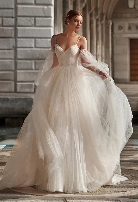 bride wearing nicole milano dress