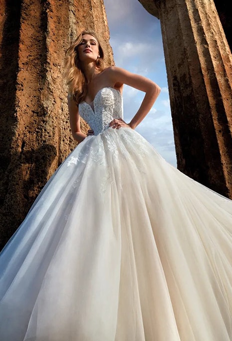 nicole-milano-selkis-dress-image-3 woman posing in nicole milano wedding dress