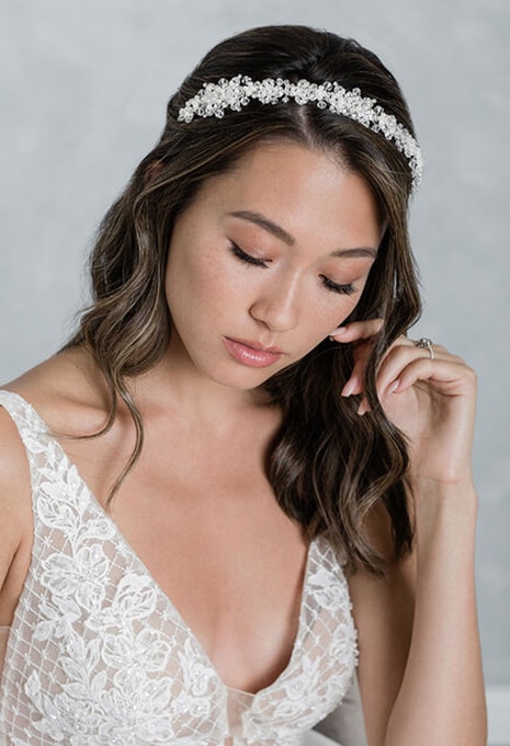 bel-aire-bridal-2026-image-2 woman wearing Bel Aire Bridal 2026 headpiece