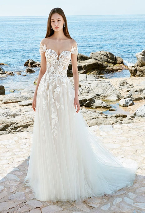 bride wearing wedding dress on beach