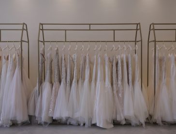plus size wedding dresses hanging on rack