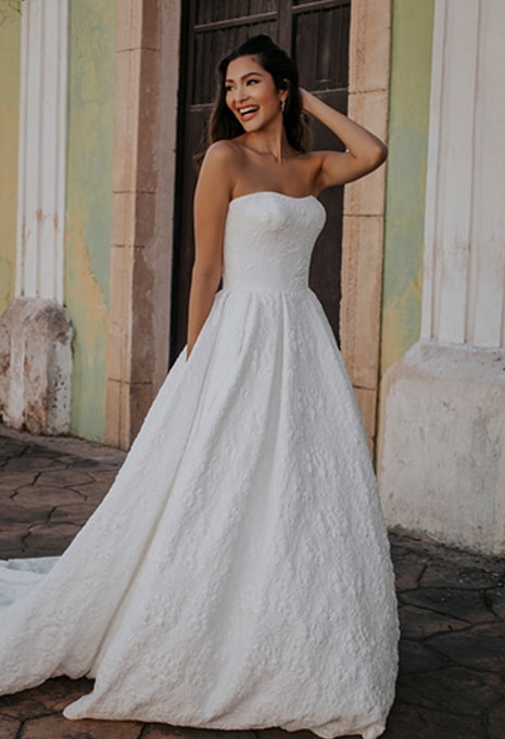 bride posing in Allure Bridals Oxford wedding dress