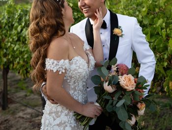 natalie and her husband smiling at each other