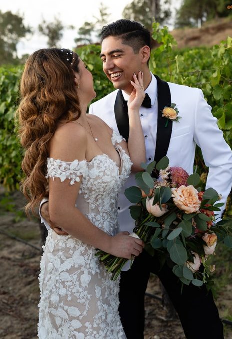 natalie and her husband smiling at each other