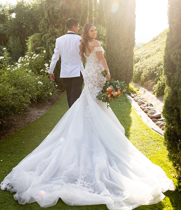 Natalie smiling and looking back with her husband