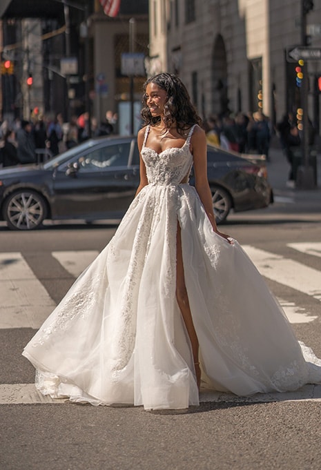 Blanche Bridal Bailey wedding dress with bride smiling in street