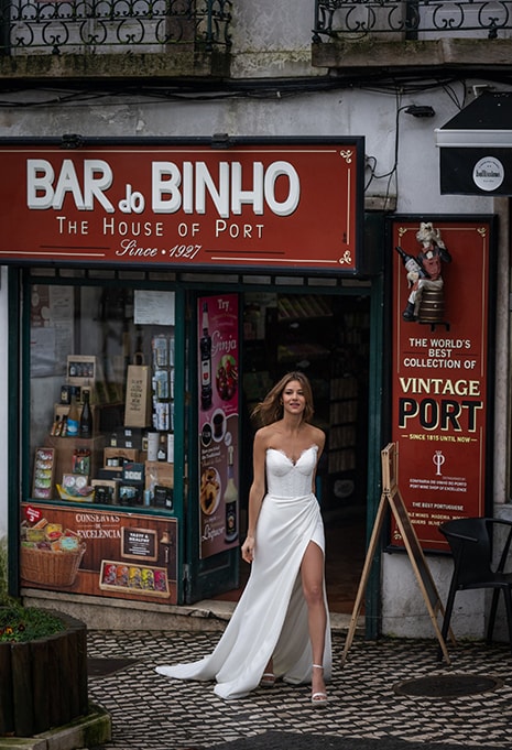 woman smiling for portrait in Allure Bridals Maria wedding gown