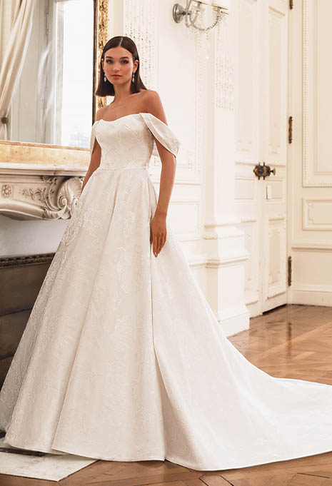 bride posing in Élysée Frederique wedding gown