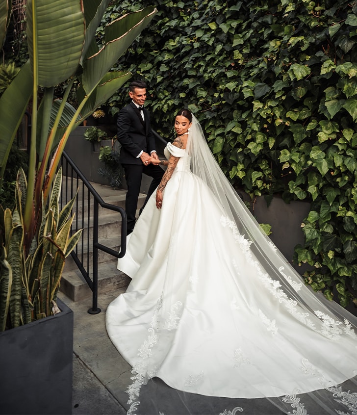 side view of bride and groom smiling on their wedding day