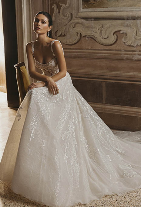 bride sitting down wearing PEN LIV Cassia wedding gown