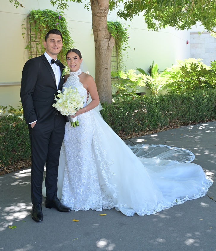 husband and bride smiling for portrait