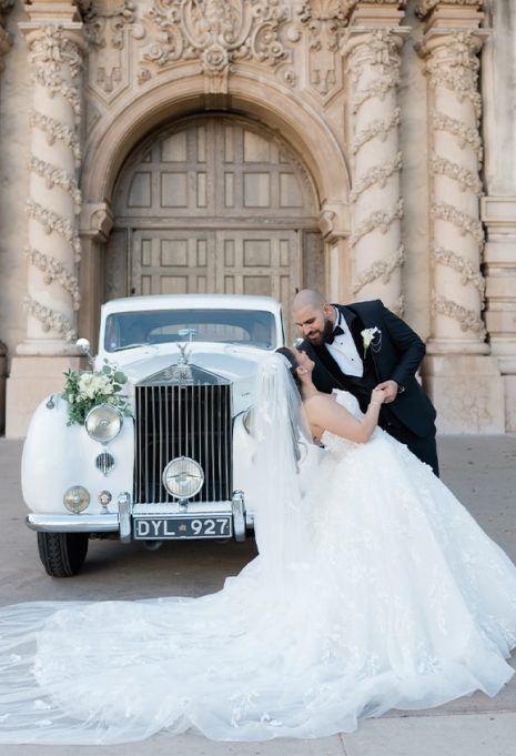 bride and groom kissing for portrait