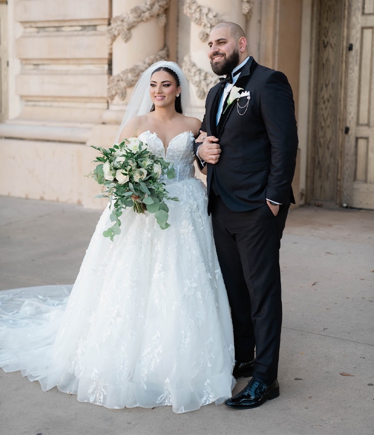 bride and groom smiling for portrait 
