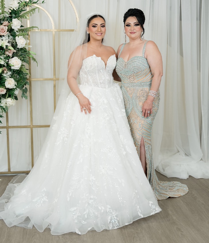 bride and woman smiling for portrait 