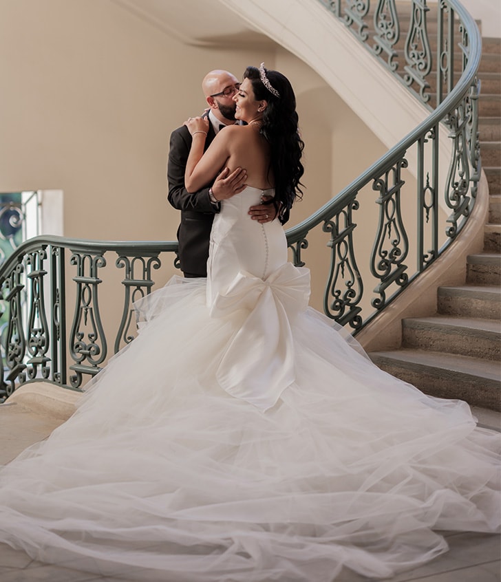 bride and groom kissing for portrait