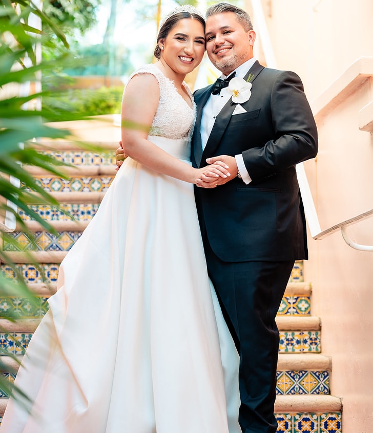 bride and groom smiling for portrait 