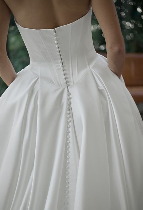 close-up back view of ÉLYSÉE Privé Fiji wedding gown