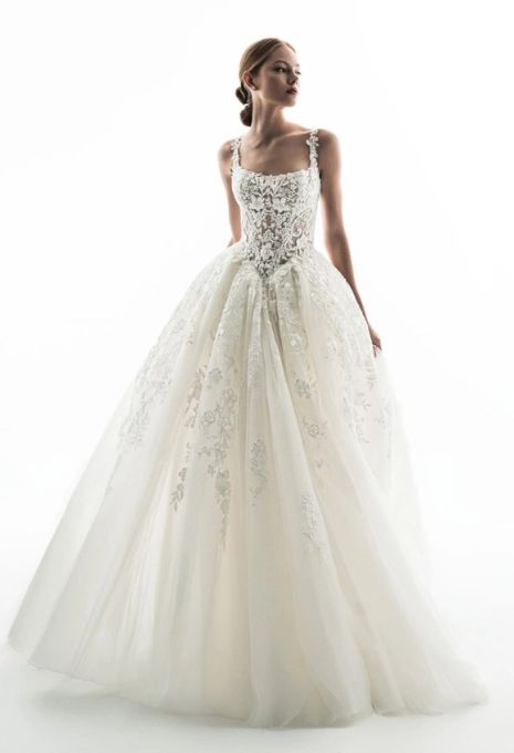 Model wearing the ÉLYSÉE Privé Geranium gown from the front
