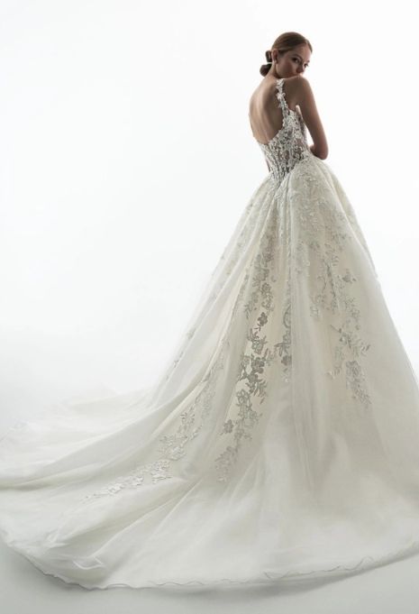 Model wearing the ÉLYSÉE Privé Geranium gown from the back