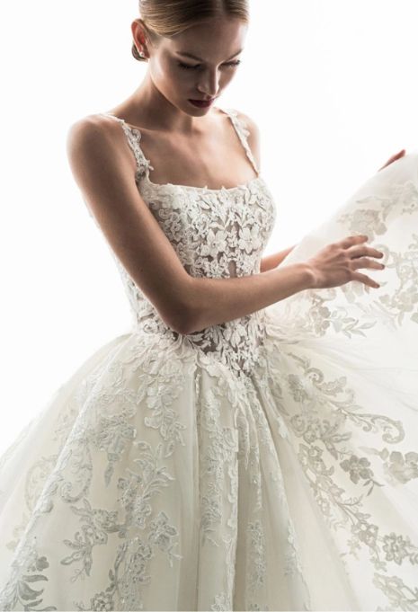 Model wearing the ÉLYSÉE Privé Geranium gown up close from the front